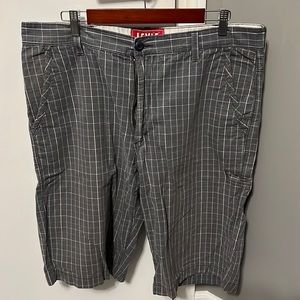 Levi’s plaid Men’s Shorts. Gray with green and white. Waist 38 and 13” inseam.